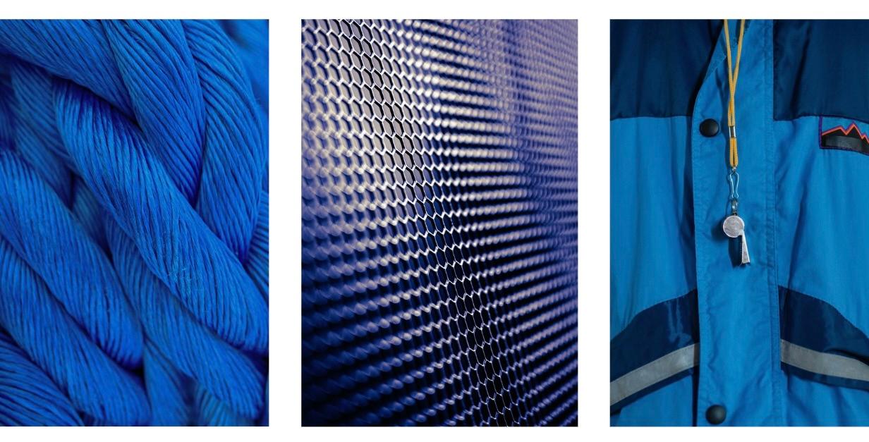 Synthetic fiber fabrics in bright colors arranged side by side to illustrate man-made textile materials